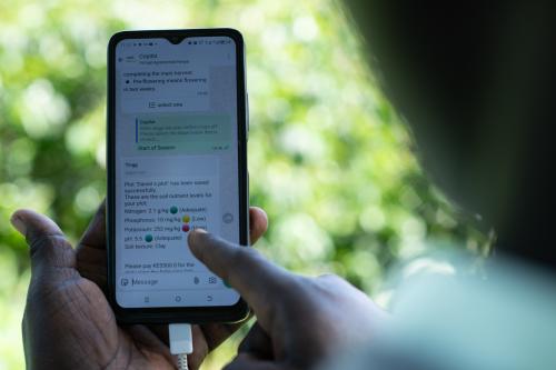 A farmer viewing the soil properties provided by Virtual Agronomist on their phone