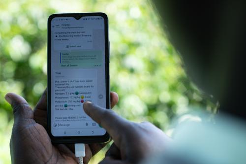 A farmer viewing the soil properties provided by Virtual Agronomist on their phone