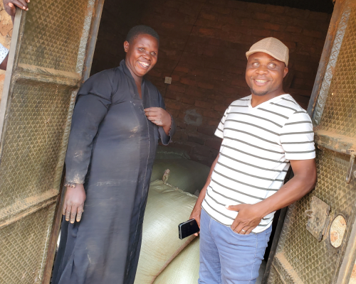 Ugandan Maize farmer Mrs. Nambozo Fat with our Southern Africa field agronomist Paul Chunga.